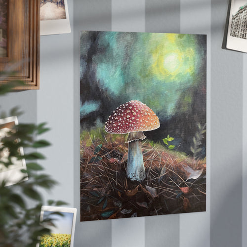 Painting print of a red-spotted mushroom in a forest setting on a wall with other pictures
