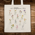 Tote bag with illustrations of Native Wildflowers of Florida on a wooden surface