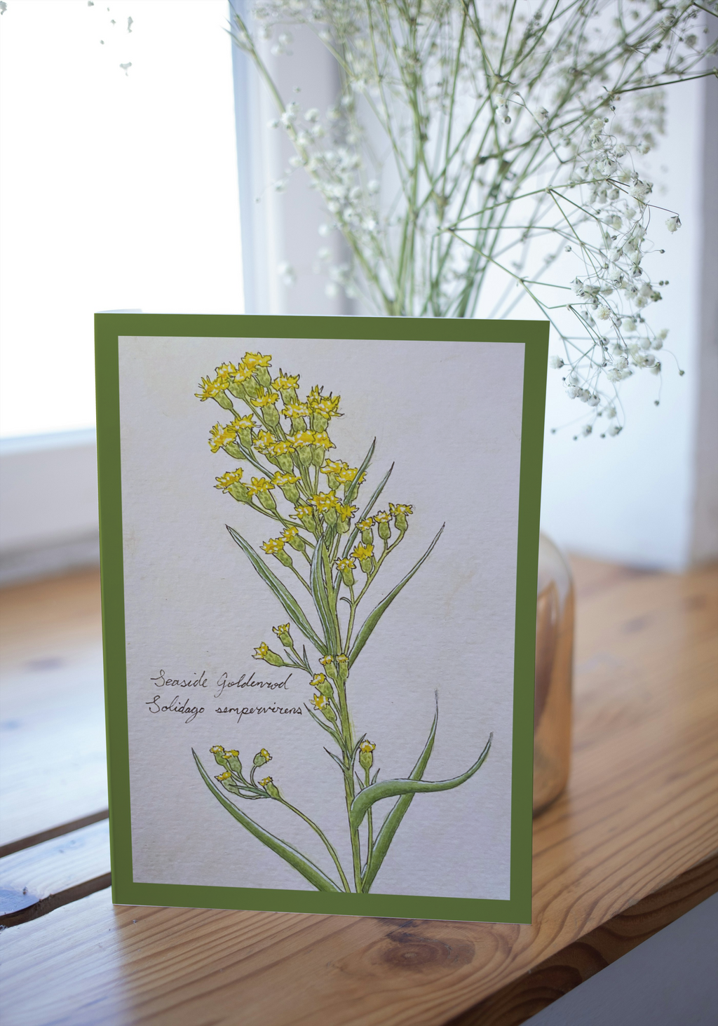 Botanical illustration card with yellow flowers on a wooden surface