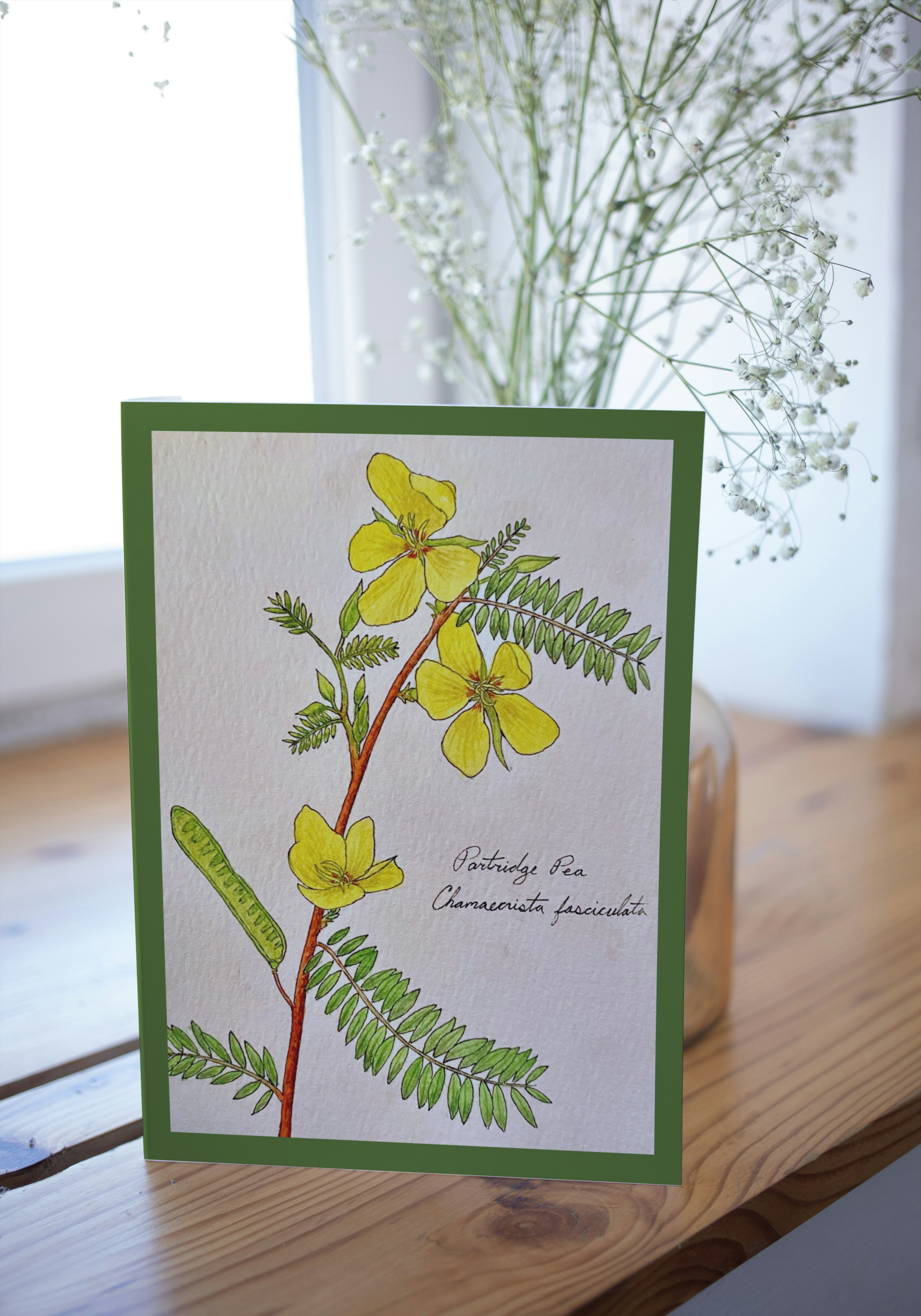 Greeting card on a wood surface with a blurred background