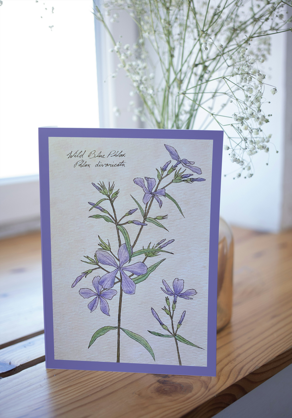 Greeting card  on wood surface with blurred background