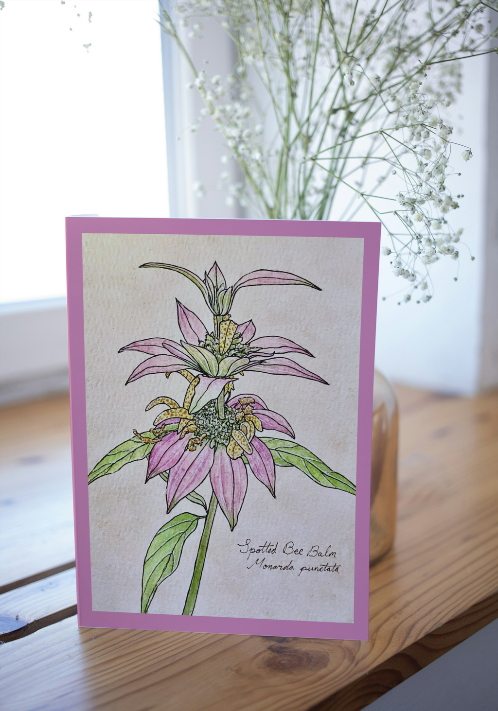 Greeting card on wood surface with blurred background