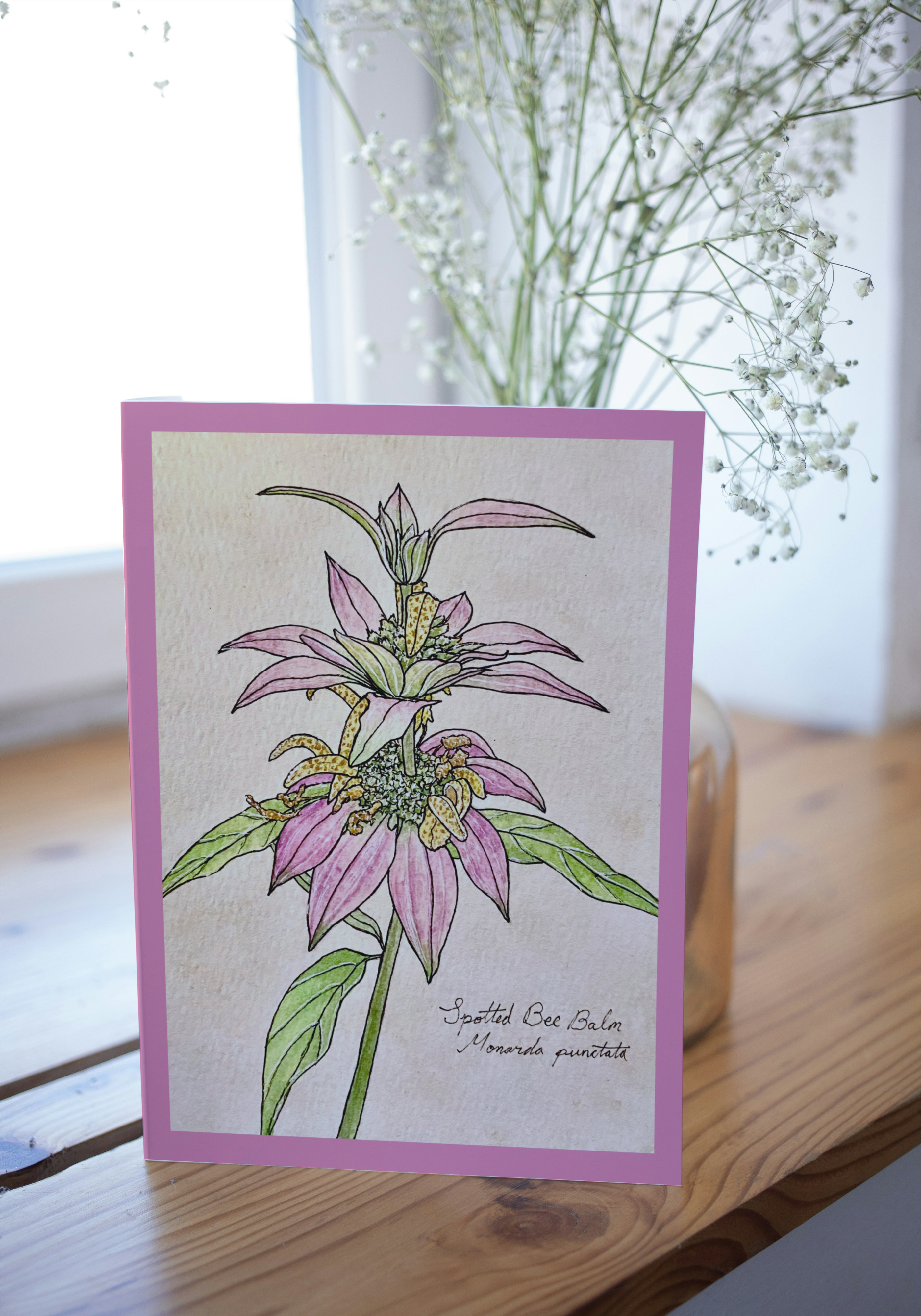 Greeting card on wood surface with blurred background