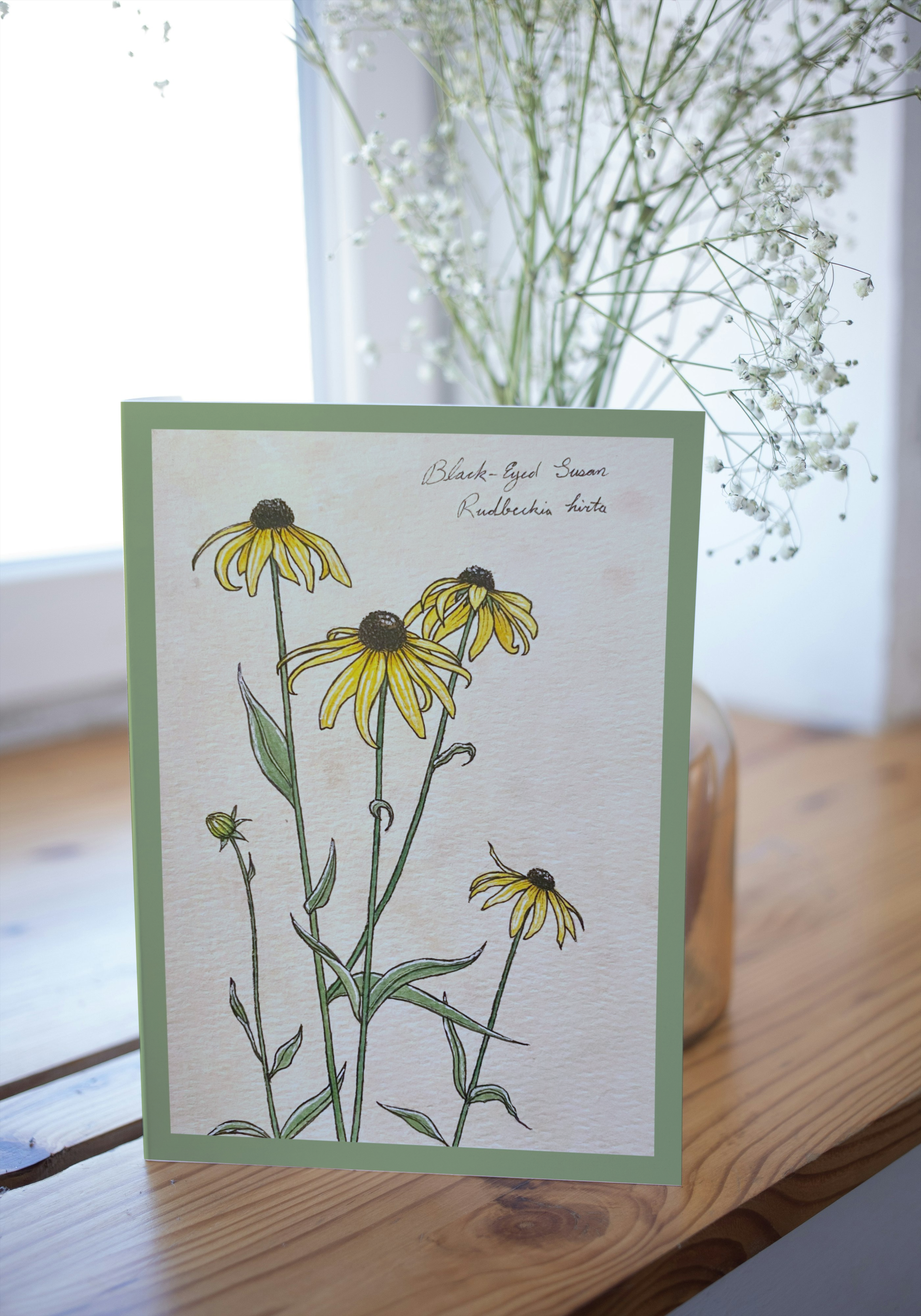 Greeting card on wood surface with blurred background