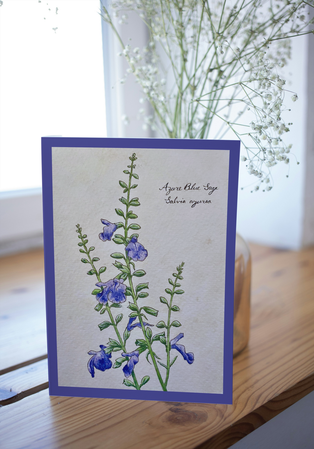 Greeting card on wood surface with blurred background