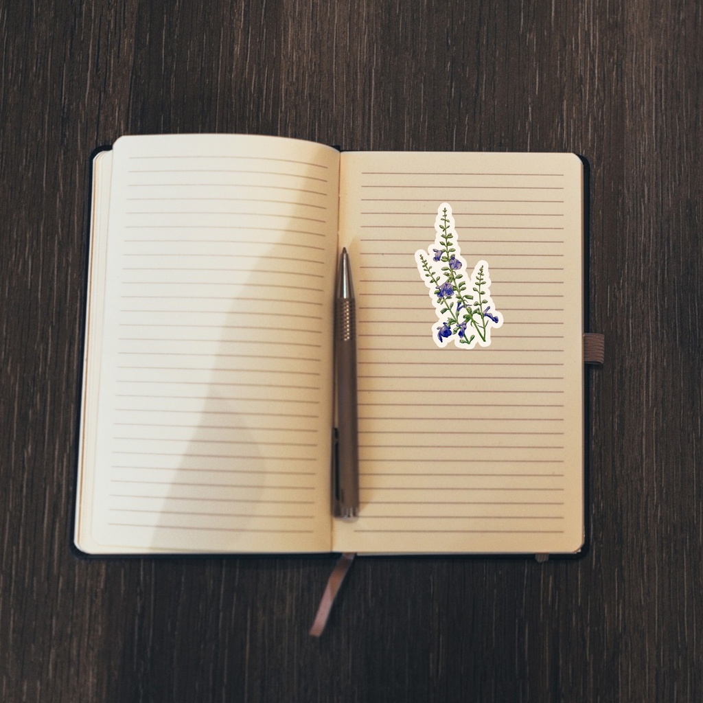 Floral sticker on an open notebook