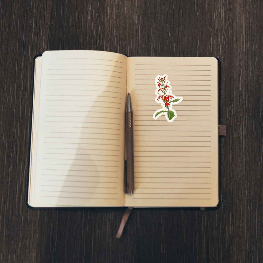 Floral sticker on an open notebook