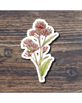 Sticker of a pink flower on a wooden surface