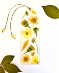 A bookmark with yellow flowers on a white background