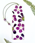 A bookmark with purple flowers on a white background