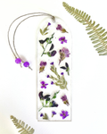 A bookmark with purple flowers on a white background