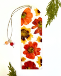 A bookmark with orange flowers on a white background