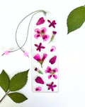 A bookmark with pink flowers on a white background