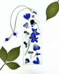 A bookmark with blue flowers on a white background